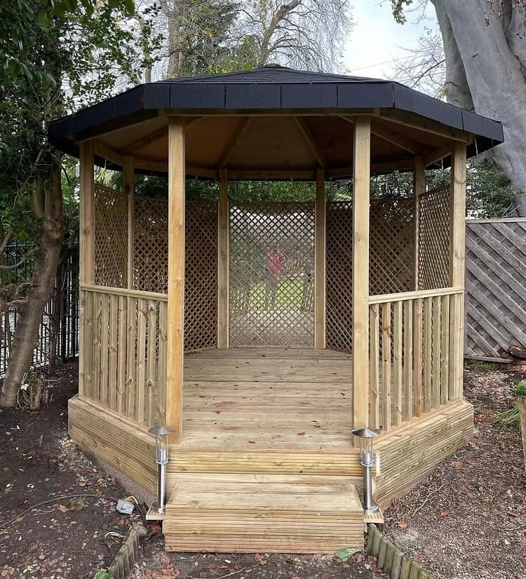 Finished bespoke timber gazebo, raised deck and lattice screening built in Hutton Mount